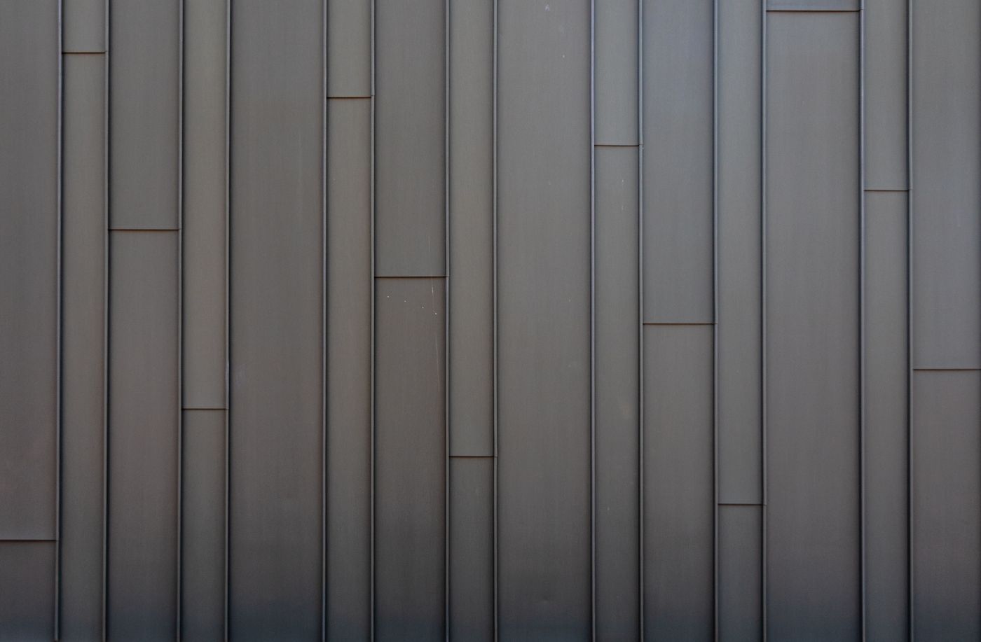Vertical steel wall panels joined edge to edge, the same principle as a Speedpanel wall